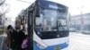 Armenia - People board a public bus in Yerevan, December 12, 2021.