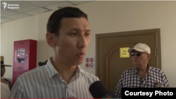 Kazakh activist Abzal Dostiyarov was summoned by police after saying he and others planned a public tribute to fellow activist Aidos Sadyqov, who was shot and killed in a car in Kyiv.