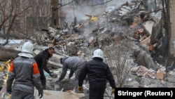 Rescuers work at the site of a Russian drone attack in Odesa on March 2.