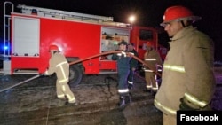 Armenian rescue workers attend a fatal bus rash on the Yerevan-Gyumri highway on August 14.