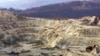 Cariera Cârnic din localitatea Roșia Montană, județul Alba. Compania Gabriel Resources a inițiat un proiect de extragere a aurului prin cianurare, fapt ce a stârnit proteste masive în România. Zeci de mii de oameni au ieșit în stradă să apere situl natural.