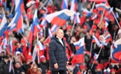 Vladimir Putin, la un concert care marchează opt ani de la anexarea Crimeei, pe stadionul Luzhniki din Moscova, 18 martie 2022.