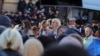 Deputata Partidului Șor, Marina Tauber, vorbindu-le protestatarilor antiguvernamentali pe 23 octombrie, la Chișinău. A participat la protestele antiguvernamentale o săptămână, înainte să fie plasată din nou în arest la domiciliu, fiind cercetată în două cauze penale.