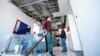 Workers clean offices in the building of the Kurdistan24 broadcaster, which was damaged in the missile attacks on March 13. 