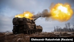 Ukrainian troops fire from a Polish Krab self-propelled howitzer toward Russian positions on the front line in the Donetsk region on January 17.