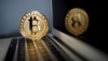 FILE PHOTO: A bitcoin is seen in an illustration picture taken at La Maison du Bitcoin in Paris
