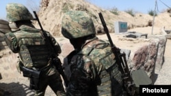 Armenian soldiers take up positions along the border with Azerbaijan, August 2, 2022.