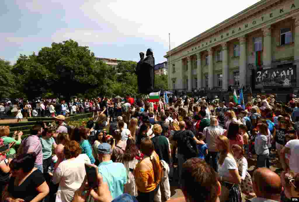 People gather to lay flowers at the base of a statue to Cyril and Methodius in central Sofia on May 24. The saints were born in today's Greece in the 9th century and are credited with creating an alphabet for the Slavic people that was later adapted during the first Bulgarian Empire to become the Cyrillic script.