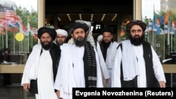 Mullah Abdul Ghani Baradar (center), who signed the peace deal with Washington on February 29, will keep the powerful post as head of the Taliban’s political office in the Gulf Arab state of Qatar.