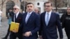George Simion (center) prepares to file his application for candidacy in Romania's May presidential election in Bucharest on March 14.