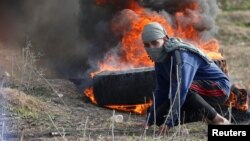 Палестинський протестувальник під час сутичок з ізраїльськими силовиками, 15 грудня 2017 року