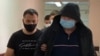 Aleksandr Kuranov is escorted to a hearing at Moscow's Lefortovo district court in August 2021.