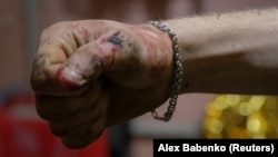 The hand of a Ukrainian soldier is seen inside a frontline medical stabilization point amid Russia's attack on Ukraine in the Donetsk region of eastern Ukraine on February 28.