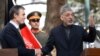 Afghan Preisdent Hamid Karzai (right) gestures as he shakes hands with NATO Secretary-General Anders Fogh Rasmussen in Kabul in mid-October.