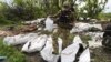 UKRAINE – A Ukrainian serviceman works during the exhumation of killed Russian soldiers' at their former positions near the village of Malaya Rohan, on the outskirts of Kharkiv, May 18, 2022