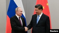 Орус президенти Владимир Путин менен Кытайдын президенти Си Цзиньпин, Бразилия, 13-ноябрь 2019-жыл.