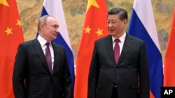 Орусиянын президенти Владимир Путин жана Кытайдын лидери Си Цзинпин. 