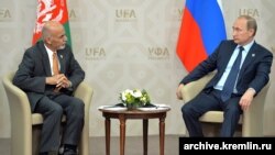 FILE: Russian President Vladimir Putin with the Afghan President Ashraf Ghani in July 2015.