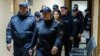 Evghenia Guțul, escortată de polițiști la ședința de judecată de pe 31 martie, de la Judecătoria Chișinău cu sediul Buiucani. Decizia a fost pronunțată pe 1 aprilie.
