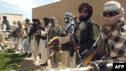 Taliban fighters pose at a mosque in Afghanistan's Ghazni Province on April 28.