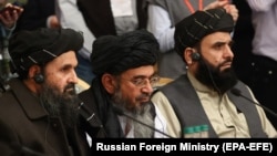 Mullah Abdul Ghani Baradar (center), the Taliban's deputy leader and chief negotiator, is leading the nine-member delegation in China. (file photo)
