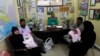 Last year, prizes included gold bars and cars, and in earlier years had given orphaned babies to two childless couples (pictured). 
