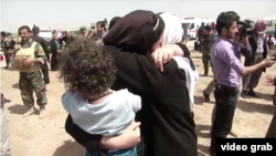 Yazidis receive aid in Kirkuk after they were released by Islamic State militants.