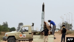 Forces loyal to Libya's UN-backed unity government prepare a missile launcher during clashes with Islamic State (IS) militants west of Sirte earlier this month. Libyan forces began the battle to retake the city from IS in May.
