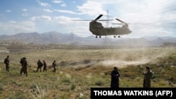FILE: U.S. military Chinook helicopter lands on a field outside the governor's palace in Maidan Shar, the capital of Wardak Province.