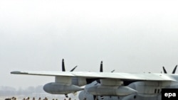 U.S. troops board at Manas on February 12