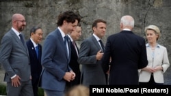 Președinta Comisiei Europene, Ursula von der Leyen, președintele Statelor Unite, Joe Biden, președintele Franței, Emmanuel Macron, prim-ministrul Italiei Mario Draghi, prim-ministrul Canadei, Justin Trudeau, prim-minisitrul Japoniei, Yoshihide Suga
