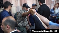 ARMENIA -- Opposition lawmaker Nikol Pashinian is greeted by his supporters in Yerevan on Wednesday, May 2, 2018. 