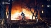 Ukrainian firefighters work at the scene of a Russian strike on Sumy on November 17. 