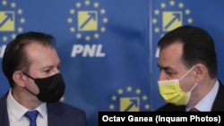 Prim-ministrul Florin Cîțu (stânga) și Ludovic Orban