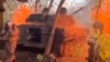 In this photo taken from a video released by the Russian Defense Ministry press service on October 30, a Russian howitzer fires toward Ukrainian positions in the Kursk border area of Russia.