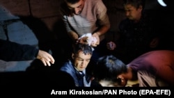 NAGORNO KARABAKH -- An injured man receives medical treatment after shelling by Azerbaijani artillery, Stepanakert, October 4, 2020