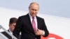 Russian President Vladimir Putin arrives at Helsinki's airport on August 21.
