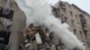 Emergency crews work at the site of the deadly Russian strike in Kryviy Rih on November 11.