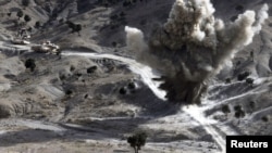U.S. soldiers blow up a roadside bomb set up by Taliban fighters near the town of Walli Was in Paktika Province last month.