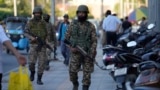 Indian paramilitary soldiers patrol as they guard at a busy market in Srinagar in Indian-administered Kashmir on April 29. 
