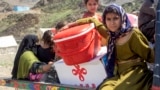 Afghan refugees deported from Pakistan arrive with their belongings at a makeshift camp near the Afghanistan-Pakistan border in Torkham, Nangarhar Province, on April 7.