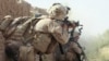 File photo of U.S. Marines return fire during a shootout in Helmand, May 2010.