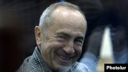 Armenia -- Former President Robert Kocharian smiles during a court hearing in Yerevan, March 30, 2021.