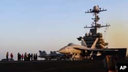 Image taken from video provided by the US Navy shows an aircraft launching from the USS Harry S. Truman in the Red Sea before air strikes in Sanaa, Yemen, on March 15.