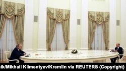 Архивска фотографија од рускиот претседател Владимир Путин и германскиот канцелар Оалф Шолц, Москва, 15 февруари, 2022.