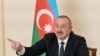 AZERBAIJAN -- Azerbaijani President Ilham Aliyev gestures as he speaks during an address to the nation in Baku, October 26, 2020