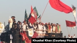 Leaders of various Pakistani political parties addressing protestors in front of the Pakistani parliament in Islamabad on October 9.