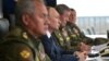 Рускиот претседател Владимир Путин (во средината), министерот за одбрана Сергеј Шојгу (лево) и началникот на Генералштабот на вооружените сили на Русија, Валери Герасимов (десно), ги набљудуваат воените вежби во септември 2021 година.