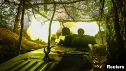 A self-propelled howitzer of the Ukraine's 57th Brigade fires in the direction of Russian positions on the outskirts of Kupyansk on April 21.