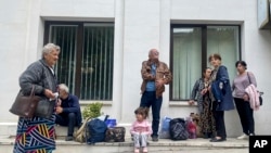 Nagorno-Karabakh - People gather near a local government building after reports of shooting in Stepanakert, Septemner 21, 2023.